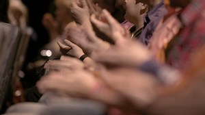 Download Clapping hands of people attending an event