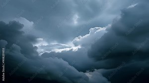 A closer look at the intricate structure of a powerful storm system with layers of dark and light clouds swirling together.