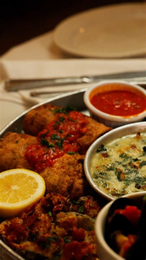 Friends Don’t Let Friends Order Small Plates. Carmine’s Hot Antipasto is overflowing with Italian favorites - meant to share, made to remember. Mussels Fra Diavolo, Clams Casino, Eggplant Rollatini, Stromboli with Prosciutto and Ricotta, Fried Fresh Mozzarella, Vegetable Stuffed Mushrooms, Cacio e Pepe Arancini, and Spinach & Artichoke Dip | Carmine's Italian Restaurant - Upper West Side