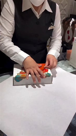 This company has one of the most satisfying teams you’ll ever see — a crew of wrapping artists who can transform chocolates or jewelry into beautifully packaged treasures in seconds. They don’t just wrap what they sell… they perform it. Clean edges, flawless folds, ribbons tied with effortless finesse — it’s truly an art form. People come just to watch the technique, mesmerized as each item is wrapped like a perfect little gift in 10–20 seconds flat. It’s skill, it’s beauty, & it’s oddly addicti