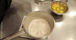 Close up of sugar in a steel syrup pot to melt it over the fire to make syrup. Dessert ingredients for confectionery.