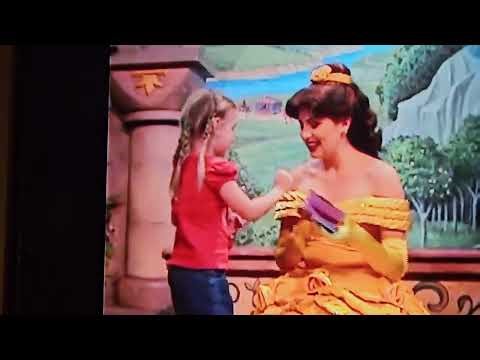 A young girl hugging princess Belle At Walt Disney World Part 3