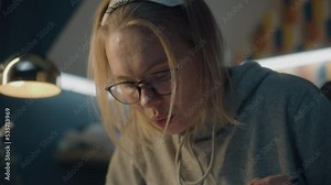 Female animator carefully draws images for her storyboard. Creative designer in a home based studio. Blows away eraser shavings. Looks at her creative work. Story telling. Stock Video