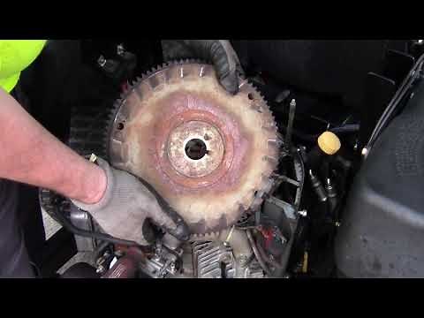 Flywheel removal on a 23hp Kawasaki engine; no puller needed.