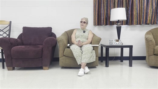 Leader Dog graduate Nikki recently completed our Orientation and Mobility program and has an important message to share. She speaks to the impact of our team members, volunteers and donors whose support makes safe, independent travel possible for people who are blind. Watch Nikki’s message below. Video Description: A woman sits in a cushioned armchair. A white mobility cane rests across her lap. | Leader Dogs for the Blind