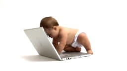Baby with laptop computer