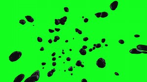 Download Exploding rocks moving towards the screen in slow motion with a green screen background for free