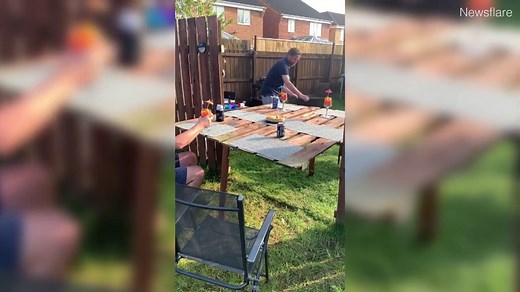 Neighbours turn fence into table so they can drink together