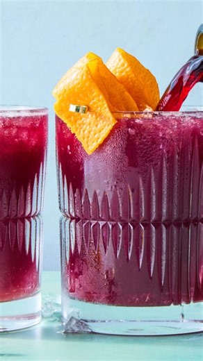 Lambrusco is like if a glass of rosé and wine had a baby. And this Lambrusco Cocktail is all of that and more — with mezcal, ginger beer and bright orange citrus 😍 Recipe by @alejandrovaldeslora #cocktails #drinks #holiday #lambrusco #gingerbeer #falldrinks #holidayrecipes | Delish