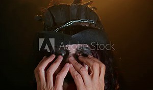 Creepy mature woman grandmother with Halloween stylish witch makeup. Old scary granny making faces, looks at camera and smiles terribly, showing tongue. Voodoo rituals. Sinister senior lady vampire