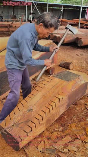 Splitting logs with axe traditional woodworking