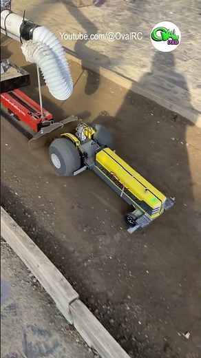 Modified RC tractor pulling with the wheels up in the air at the Worlds