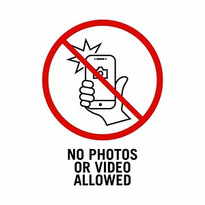Download No photos or video allowed sign vector. It is prohibited to take a photo here. A sign prohibiting or restricting taking pictures vector template. for free