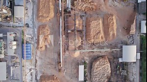 Aerial view of green energy processing plant for environment ecology with building warehouse, refinery tower, soil resource storage and chemical processing technology