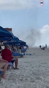 This is the moment a towering waterspout appeared on a Florida beach! 🌀 | Daily Mail Video