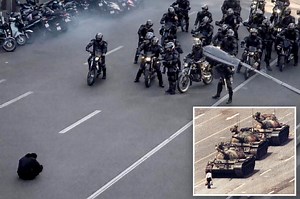 Powerful image of lone Iranian protester in front of security forces draws parallels to Tiananmen Square 'Tank Man'