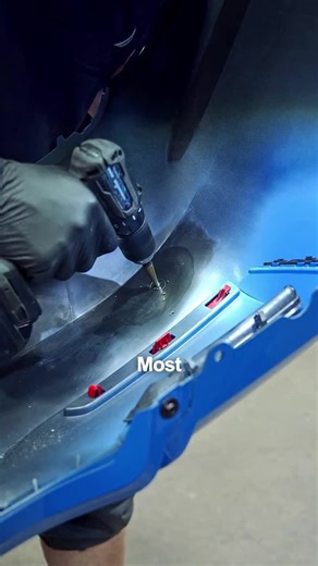 That moment a customer walks in and sees us drilling into a brand new BMW bumper 😅 BMW does something pretty smart: they make one bumper cover that works across multiple trims—some cars get parking sensors, some get surround view, some get park assist, and some get none. Instead of producing a different bumper for every setup, the bumper is molded with hidden guide marks on the inside so we can punch the holes exactly where they’re supposed to go. And “exactly” matters. If a sensor hole is even