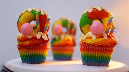 Rainbow cupcakes with colorful toppings