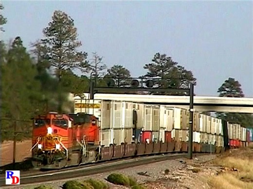 36K views · 1.5K reactions | At Flagstaff, Arizona, a BNSF westbound stack train works up the steady grade that began out of Winslow, 50 miles to the east. The summit of the Arizona Divide lies ahead. From the BKVP show https://rfd.video/ReturnArizona | Railfan Depot | Facebook