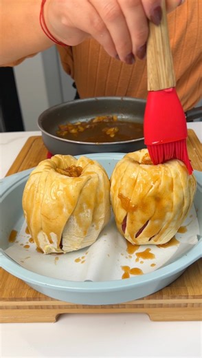 Try out this delicious apple pastry I wrapped a whole apple in puff pastry and stuffed it with delicious caramelized crushed apples and brown sugar. | Cirqnamics