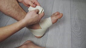Compression Ankle Stabilizer Bandage. Leg Injury and Sprain of Young Sportsman Stock Video - Video of shoes, injury: 243879829