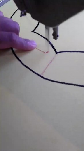 Sewing Floral Patterns on Yellow Fabric Using Machine