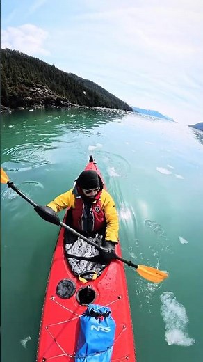 Kayaking beside a glacier in Alaska