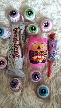 ASMR popular candies, rainbow lollipops, colorful sweets, unpacking chocolate and eating sounds