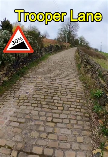 The Hardest cobblestone climb in Europe? @British Cycling challenged me to find and ride the toughest cobbles in Britain so I naturally went to Halifax, the home of insane cobblestone climbs and Trooper lane is the headline act of a long list of brutal climbs. 0.5 miles/ 0.8 km Averages 14.7% Max 30% 📍 location using @what3words ///bells.gaps.cope My bike set up helped massively here. I had 32mm tyres with a lower psi of 60 compared to normally 85psi. I also used very easy gearing to help me re