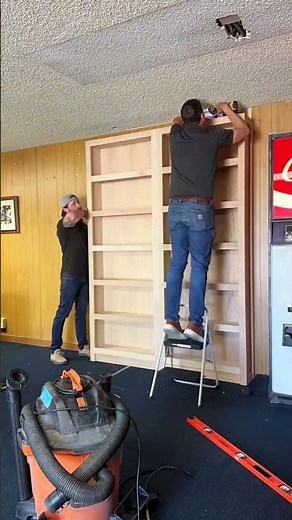 This custom sliding bookcase will make you question everything 🤯#bookcase #murphydoor