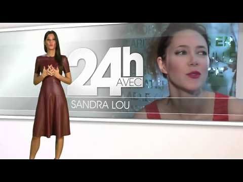 Malika Menard in full long red leather dress presenting TV show