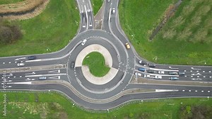 Dutch roundabout on road N459 from A12 at Reeuwijk near Gouda in Netherlands. Traffic flows at efficient pace with cars in highway lanes entering and exiting motorway. drone aerial view of transport