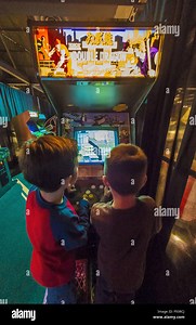 Garden City, New York, USA. 12th Dec, 2015. L-R, DANIEL TORRES, 5, and NATHANIEL PEREZ, 4, play the 1988 arcade game Double Dragon II: The Revenge, by Technos/Romstar, during Opening Day of Arcade Age exhibit, in an arcade set up at Cradle of Aviation Museum in Long Island. Admission includes unlimited free pay-to-play of video arcade games. Exhibit runs from Dec. 12, 2015 through April 3, 2016. © Ann Parry/ZUMA Wire/Alamy Live News Stock Photo - Alamy