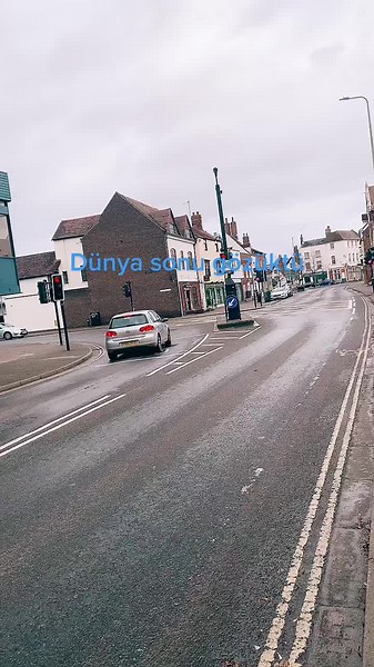 Urban Street Scene with Modern Vehicles and Pedestrians