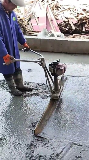 Using a Power Screed to Level and Smooth Wet Concrete for Solid Foundations