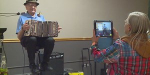 Weston man, concertina player celebrates 90th birthday party with family, friends, and music