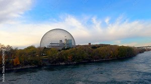 Biosphere of Montreal at Park Jean Drapeau Montreal Canada, Environment Museum, Hard Steel Truss Architectural Structure-Dome next to River, Beautiful Sunset Landscape view, blue cloudy sky