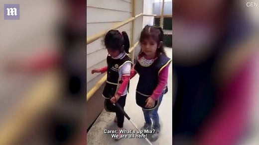 Blind girl teaches visually impaired friend how to use walking cane