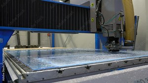 Milling cutter cuts plastic part on robotized production line. Factory robots used to produce precise an strict product on automation conveyor lines.