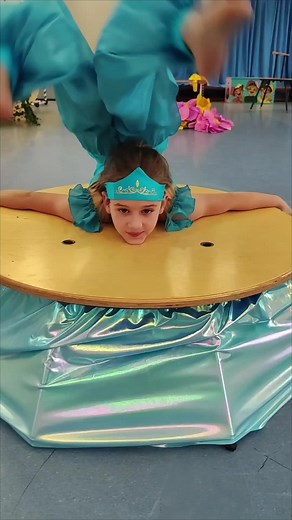 Child's Acrobatic Dance Performance on Wooden Platform
