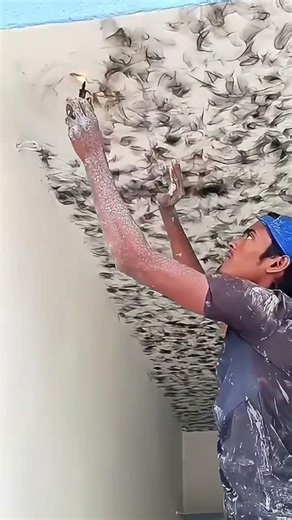Burning wax creates abstract patterns above white ceilings,forming textured artistic design uniquely