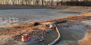 Industrial wastewater pond used for fertilizer causing strong odor near Fairview, Mo.