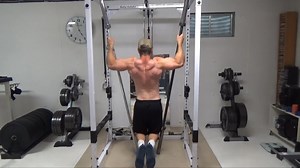 [Watch at least 30 seconds of this one for full effect] - Two Vertical Bar Pull-Ups With Isometric Slide. This is a killer pull-up variation for targeting the grip as well as lats and upper back. The setup is simple...set two Olympic bars into the corners of the rack at a high angle (as vertical as you can get them with good stability). Kneel down in front of the bars, grip high up on the bars and do pull-ups. Here comes the fun part...because the bars are set vertically, as your grip fatigues, 