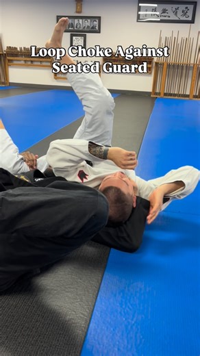Zuka on Instagram: "A Loop Choke To Counter Seated Guard. #loopchoke #bjj #seatedguard #bjjtechnique"