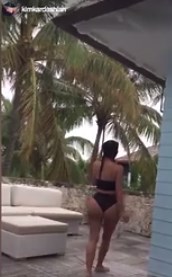Kim K strips down to bikini and knocks back tequila shots