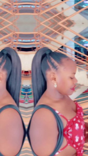 Stylish Woman in Red Dress Captured in Modern Setting