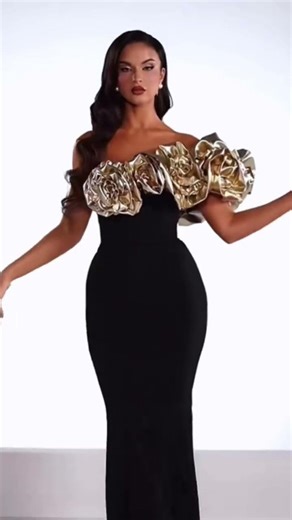 Share with a friend who would own the spotlight in this black corset column gown! To order, send us