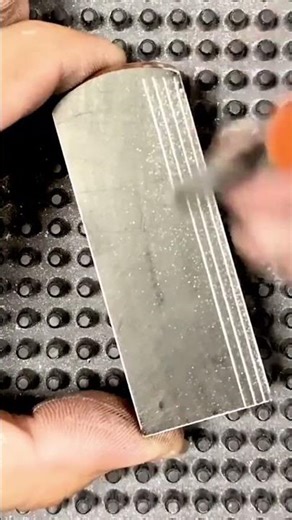 Worker Creates Parallel Grooves On Metal Block