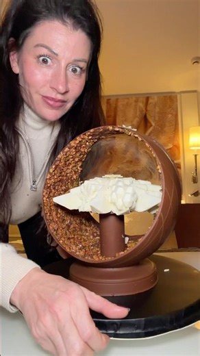 This yule log comes in 2 parts and is presented like a Christmas bauble!