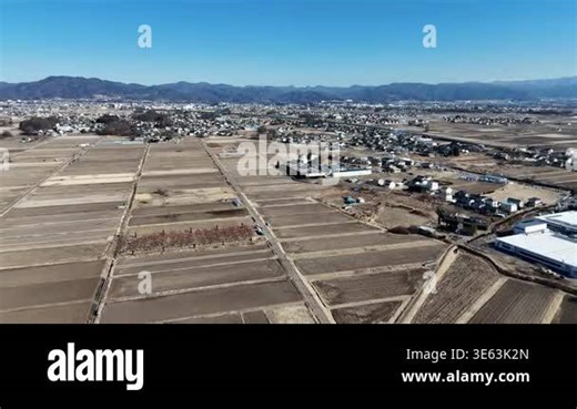 Aerial view of agricultural fields and buildings Stock Video Footage - Alamy